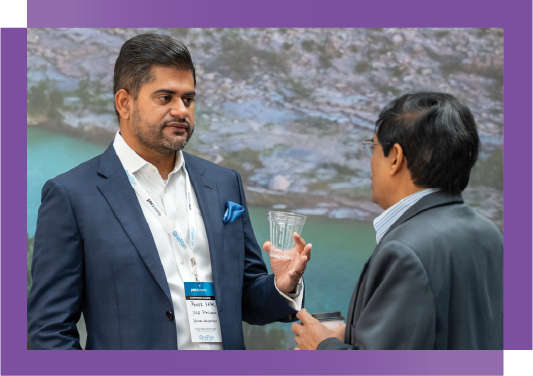 Professional networking at AI in Oil and Gas Conference, artificial intelligence in oil and gas industry event, Delegate enjoying coffee during AI in Oil and Gas networking session